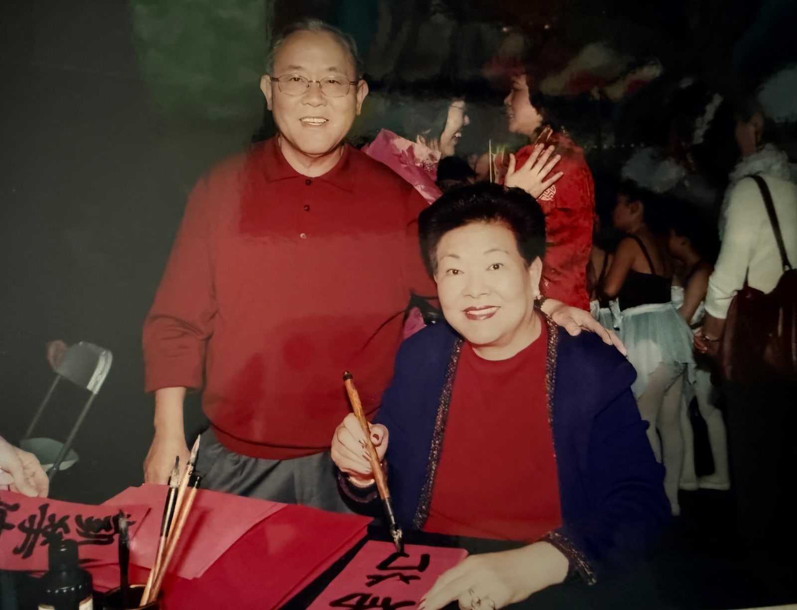 Writing calligraphy at a costume party