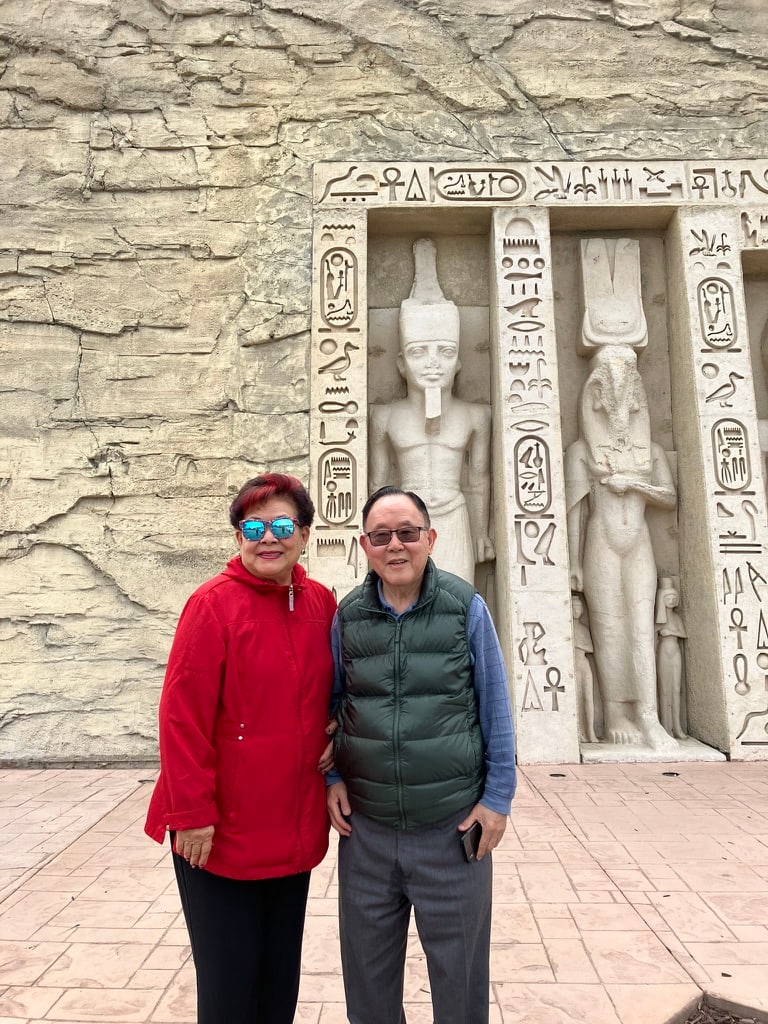 Before Egyptian-style statues