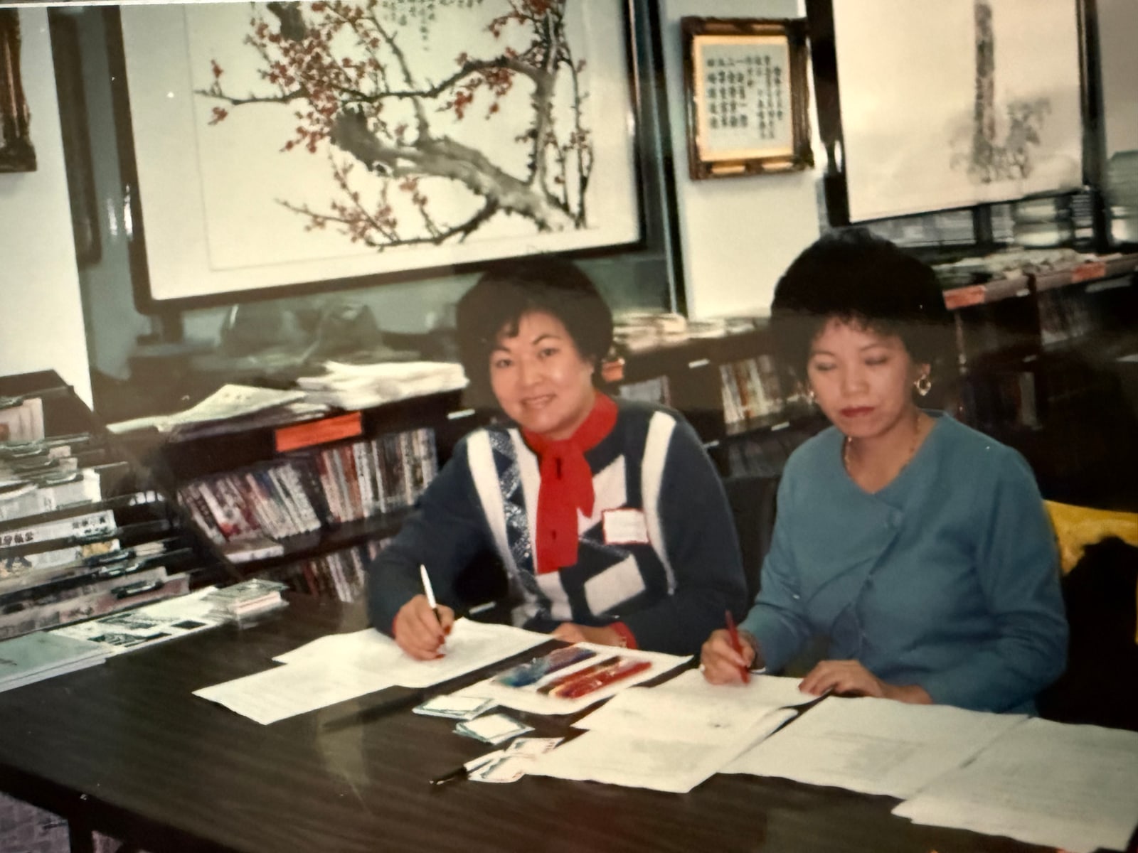 Signing papers at a desk
