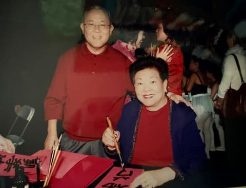 Writing calligraphy at a costume party