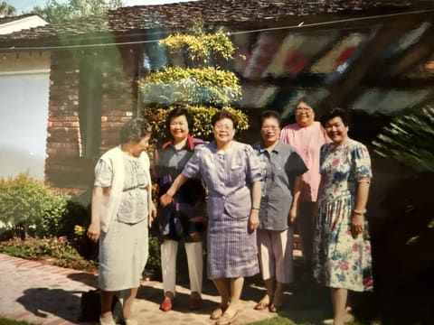 With friends outside a house